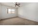 Bedroom with carpet, window and ceiling fan at 10856 E Kiva Ave, Mesa, AZ 85209