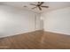 Bright bedroom with wood floors and ceiling fan at 10856 E Kiva Ave, Mesa, AZ 85209