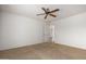 Spacious carpeted bedroom featuring a ceiling fan at 10856 E Kiva Ave, Mesa, AZ 85209