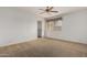 Bedroom with carpet, window, and ceiling fan at 10856 E Kiva Ave, Mesa, AZ 85209