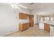 Kitchen with wooden cabinets and white appliances at 10856 E Kiva Ave, Mesa, AZ 85209