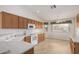 Bright kitchen features ample wood cabinets and white appliances at 10856 E Kiva Ave, Mesa, AZ 85209