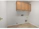 Tile floor laundry room with upper cabinets at 10856 E Kiva Ave, Mesa, AZ 85209