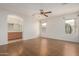 Bright main bedroom featuring wood floors and ensuite bathroom at 10856 E Kiva Ave, Mesa, AZ 85209