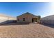 A spacious backyard featuring a covered patio, offering a great outdoor space at 11230 E Cliffrose Ln, Florence, AZ 85132