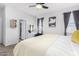 Bright main bedroom with a ceiling fan, decor, and neutral tones creates a relaxing space at 11230 E Cliffrose Ln, Florence, AZ 85132