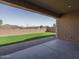 Expansive backyard with artificial turf, a brick paver border, and a block wall for added privacy at 11529 N 170Th Ln, Surprise, AZ 85388