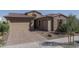 Beautiful home featuring a brick driveway, a three-car garage, and a tile roof at 11529 N 170Th Ln, Surprise, AZ 85388