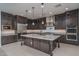 Modern kitchen featuring stainless steel appliances, ample counter space, and a kitchen island at 11529 N 170Th Ln, Surprise, AZ 85388