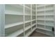 Walk-in pantry featuring ample shelving and storage for organized kitchen essentials at 11529 N 170Th Ln, Surprise, AZ 85388