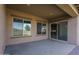 Covered patio featuring neutral tones, with view of lush green lawn and desert landscaping at 11529 N 170Th Ln, Surprise, AZ 85388