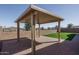 Outdoor pergola providing shade and style to the backyard living space, with a ceiling fan at 11529 N 170Th Ln, Surprise, AZ 85388