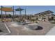 Community playground featuring covered sandboxes, swings, and shade canopies at 11529 N 170Th Ln, Surprise, AZ 85388