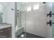 Modern glass shower with dual shower heads and tiled surround at 11529 N 170Th Ln, Surprise, AZ 85388