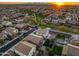 Aerial view of a residential area with green spaces, parks, and diverse home designs at 12118 W Villa Chula Ct, Sun City, AZ 85373