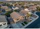 Aerial view of a residential area with well-maintained homes, swimming pools, and lush landscaping at 12118 W Villa Chula Ct, Sun City, AZ 85373