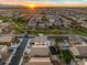 Aerial view showcasing a community with parks, playgrounds, swimming pools, and solar panels at 12118 W Villa Chula Ct, Sun City, AZ 85373