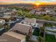 Aerial view of a neighborhood with well-maintained homes, green spaces, and community amenities at 12118 W Villa Chula Ct, Sun City, AZ 85373