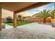 Manicured backyard featuring playset, green turf, and a spacious patio at 12118 W Villa Chula Ct, Sun City, AZ 85373