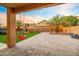 Patio view of backyard with play-set and green turf at 12118 W Villa Chula Ct, Sun City, AZ 85373