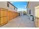 View of the backyard with a fence, shed, and patio, offering ample space for outdoor activities and storage at 12118 W Villa Chula Ct, Sun City, AZ 85373