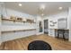 Large walk-in closet/dressing room with vanity, black rug, and ample storage at 12118 W Villa Chula Ct, Sun City, AZ 85373