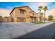 Charming two-story home with a well-manicured lawn, a two-car garage, and a welcoming entrance at 12118 W Villa Chula Ct, Sun City, AZ 85373