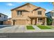 Charming two-story home with a two-car garage and a meticulously maintained front lawn at 12118 W Villa Chula Ct, Sun City, AZ 85373