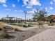 View of community amenities featuring playground, clubhouse, and common areas with walkways at 129 N 175Th Ave, Goodyear, AZ 85338