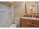 Inviting bathroom featuring a vanity with a sink, new toilet and a tub with shower at 13134 N 20Th Ave, Phoenix, AZ 85029