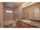 Cozy bathroom offers a shower-tub combo, new toilet and a vanity with a sink at 13134 N 20Th Ave, Phoenix, AZ 85029