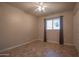 Comfortable bedroom features a ceiling fan, tile floors, and ample natural light at 13134 N 20Th Ave, Phoenix, AZ 85029