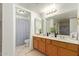 Bright bathroom features a double sink vanity, tile flooring, and plenty of counter space at 14224 N 26Th Ln, Phoenix, AZ 85023