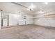 Spacious garage with overhead storage, shelving, and includes a washer, dryer, and water heater at 14224 N 26Th Ln, Phoenix, AZ 85023