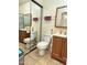 This bathroom features a toilet, vanity with mirror, and a glass shower door at 1434 E Roosevelt St, Phoenix, AZ 85006