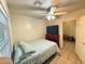 Bedroom with cozy bed, dresser, and tile flooring at 1434 E Roosevelt St, Phoenix, AZ 85006