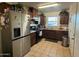 Well-equipped kitchen featuring stainless steel appliances, dark cabinetry and tile flooring at 1434 E Roosevelt St, Phoenix, AZ 85006