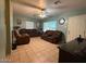 Inviting living room with tile flooring, comfortable seating, and abundant natural light at 1434 E Roosevelt St, Phoenix, AZ 85006