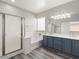 Bathroom featuring a shower, large tub, and double sink vanity with modern fixtures at 14425 N 137Th Ln, Surprise, AZ 85379