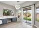 Dining area with natural light with backyard access and built in desk space with granite counters at 14425 N 137Th Ln, Surprise, AZ 85379