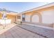 Enclosed courtyard with tiled patio and desert landscaping, creating a private outdoor space at 14510 W Yosemite Dr, Sun City West, AZ 85375