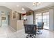 Cozy dining area with sliding glass door access to the patio and a stylish chandelier at 14510 W Yosemite Dr, Sun City West, AZ 85375