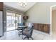 Bright breakfast nook with tiled flooring, built-in cabinets, and a view of the covered patio at 14510 W Yosemite Dr, Sun City West, AZ 85375