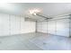 Garage with epoxy floor and large storage cabinets at 14510 W Yosemite Dr, Sun City West, AZ 85375