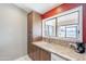 Close up of kitchen sink and granite countertop, with a view to outdoor patio at 14510 W Yosemite Dr, Sun City West, AZ 85375