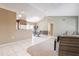 Open-concept living area with tile floors, connecting seamlessly to the kitchen and dining spaces at 14510 W Yosemite Dr, Sun City West, AZ 85375