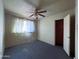 A simple bedroom design with carpet and a ceiling fan at 1466 E Nielson Ave, Mesa, AZ 85204