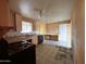 Kitchen featuring vintage appliances, tile flooring, and bright natural light at 1466 E Nielson Ave, Mesa, AZ 85204