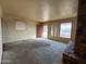 Living room featuring a stone fireplace, carpet, and natural light at 1466 E Nielson Ave, Mesa, AZ 85204