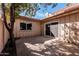 Cozy backyard with privacy fence and large sliding glass doors at 1517 E Dunbar Dr, Tempe, AZ 85282